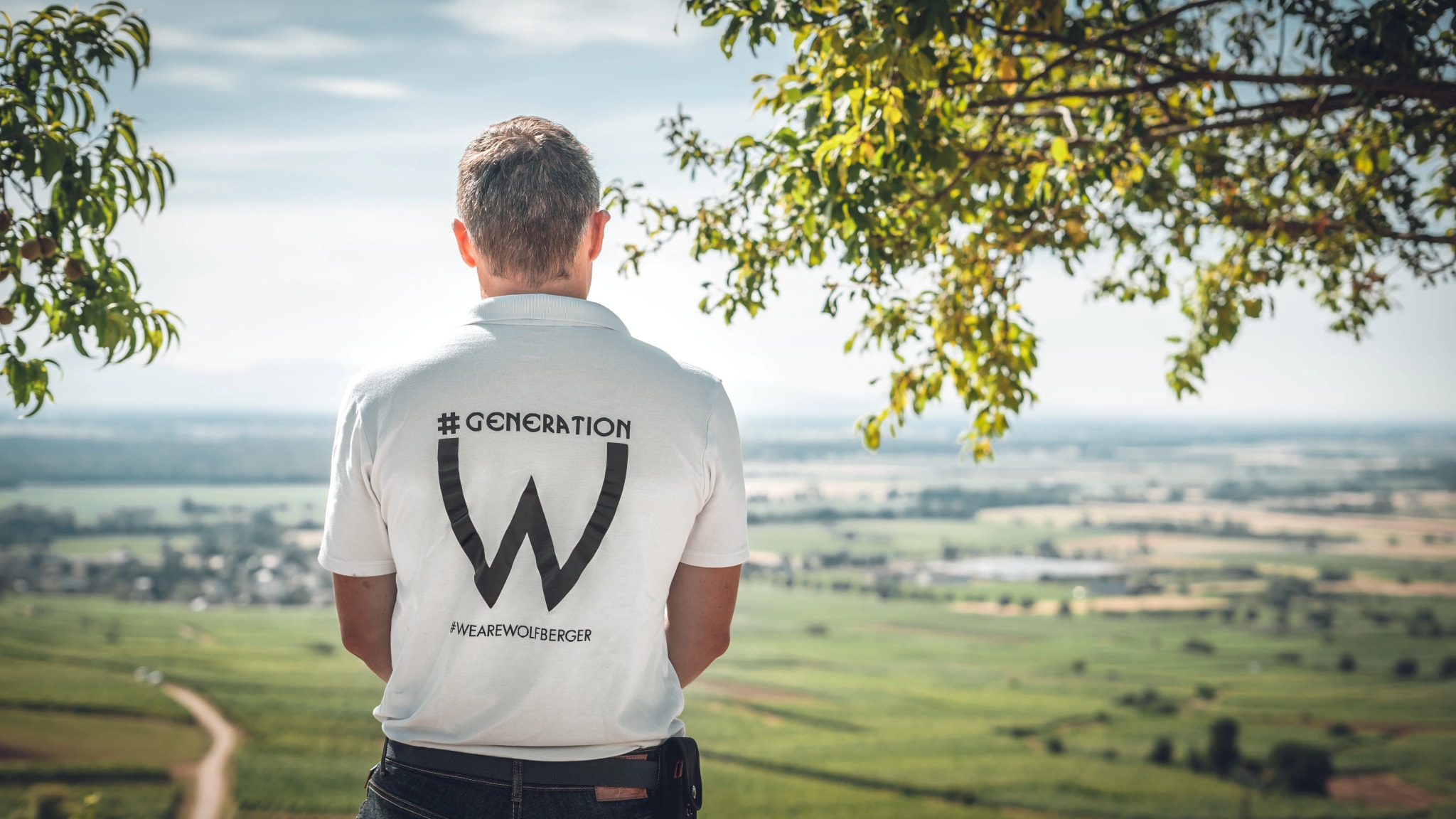 A Wolfberger grower looking out over the vineyards and the Alsace plain