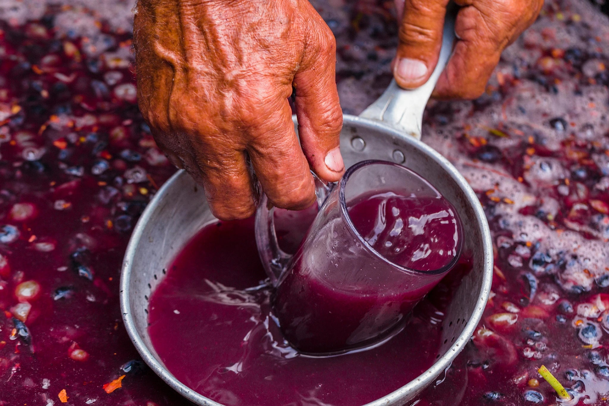 Red wine ferments with its skins, extracting color, tannin, and flavor from dark grape varieties such as Cabernet Sauvignon, Merlot, and Pinot Noir.