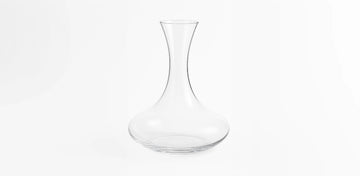 Gently pour the wine down the side of the decanter to maximize aeration and preserve clarity.