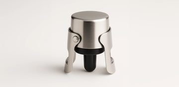 Use a sparkling wine stopper to clamp the bottle securely and maintain internal pressure, keeping the bubbles fresh for several days.